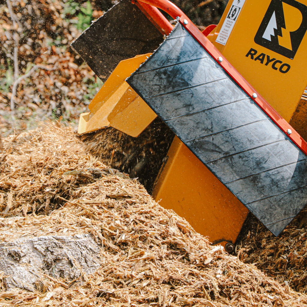 Rayco Stump Removal Machine Actively Grinding a Tree Stump Into Wood Chips for Professional Stump Removal in Carroll County, MD