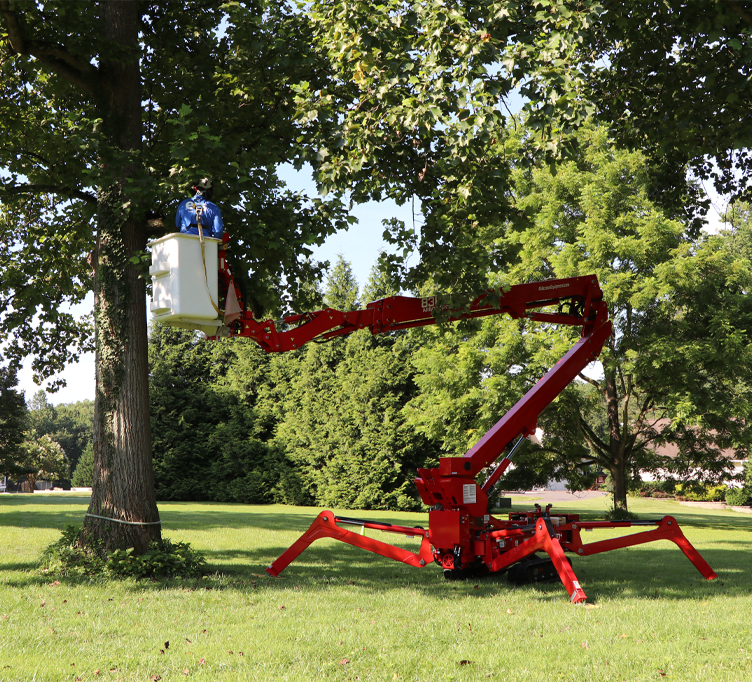 eos Tree Services Arborist in a Tracked Aerial Lift Bucket Performing Tree Trimming on a Large Mature Tree in Frederick County, MD